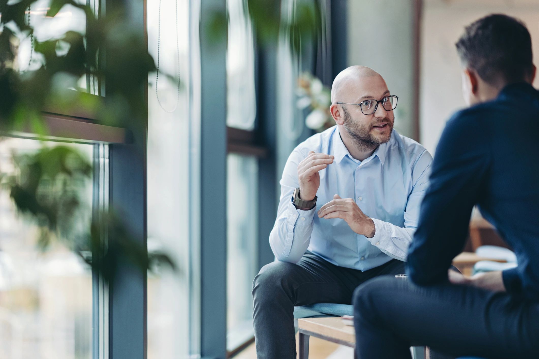 Consulting conversation between business professionals